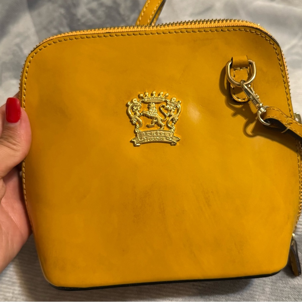 Elegant Mustard Crossbody Bag with Gold Emblem